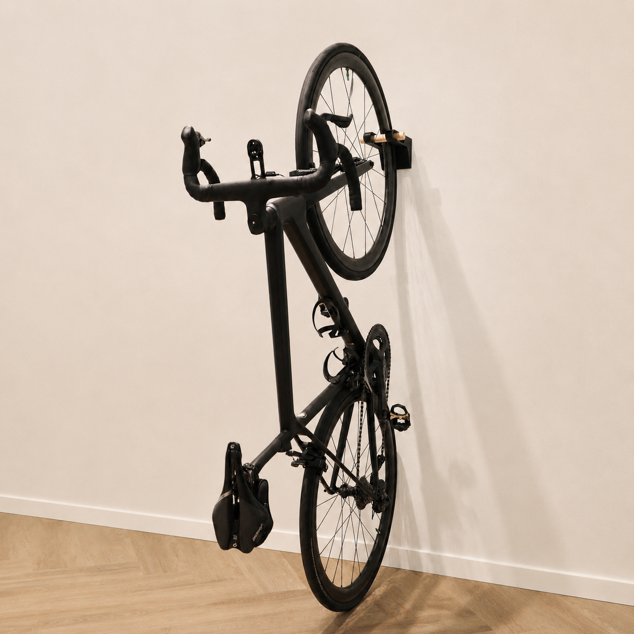 Close-up of a StudioVelo3D wall mount holding a road bike.
