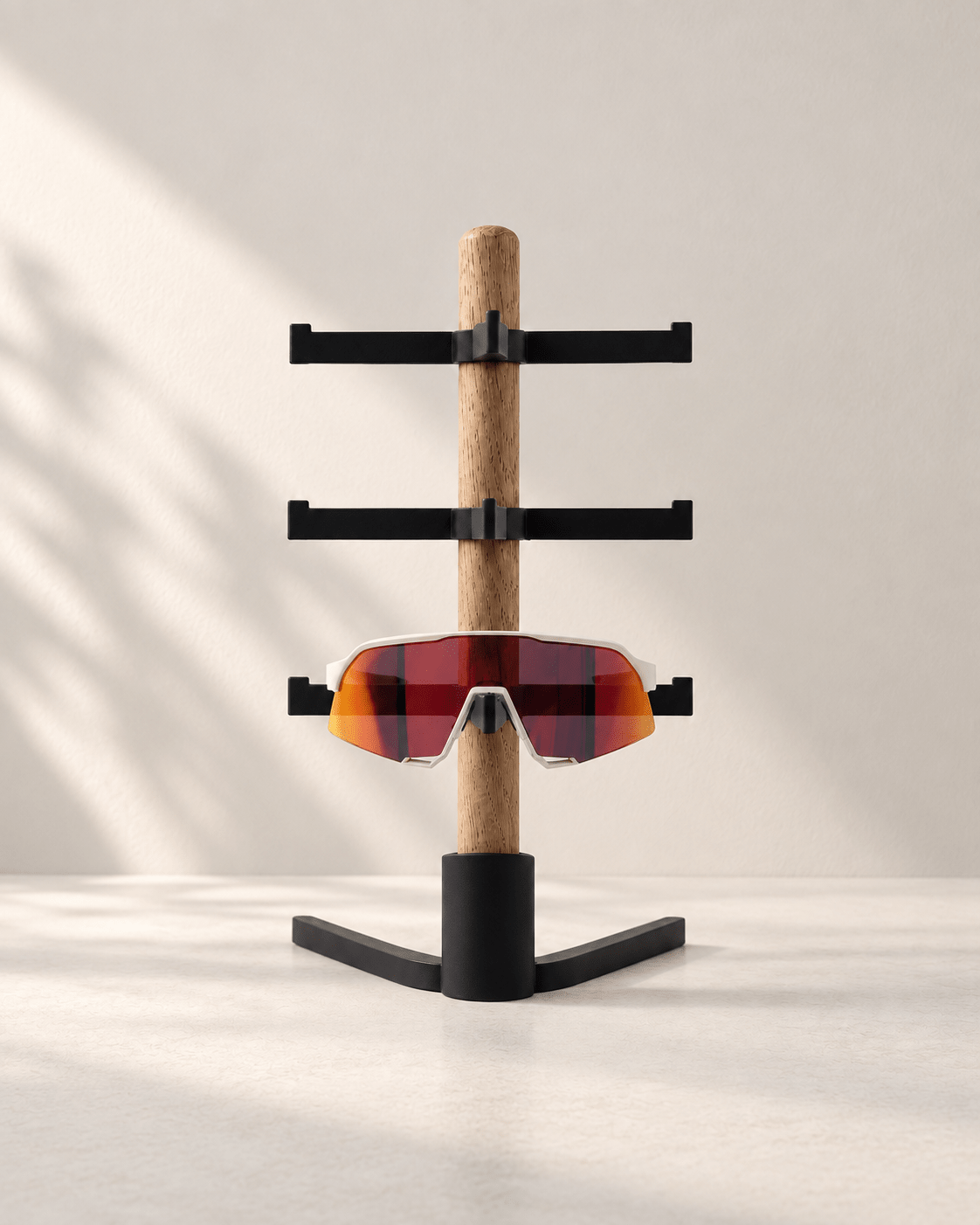 Desk Organizer Wing – oak glasses stand with three glasses holders on a slim 3D-printed Wing base, holding cycling sunglasses